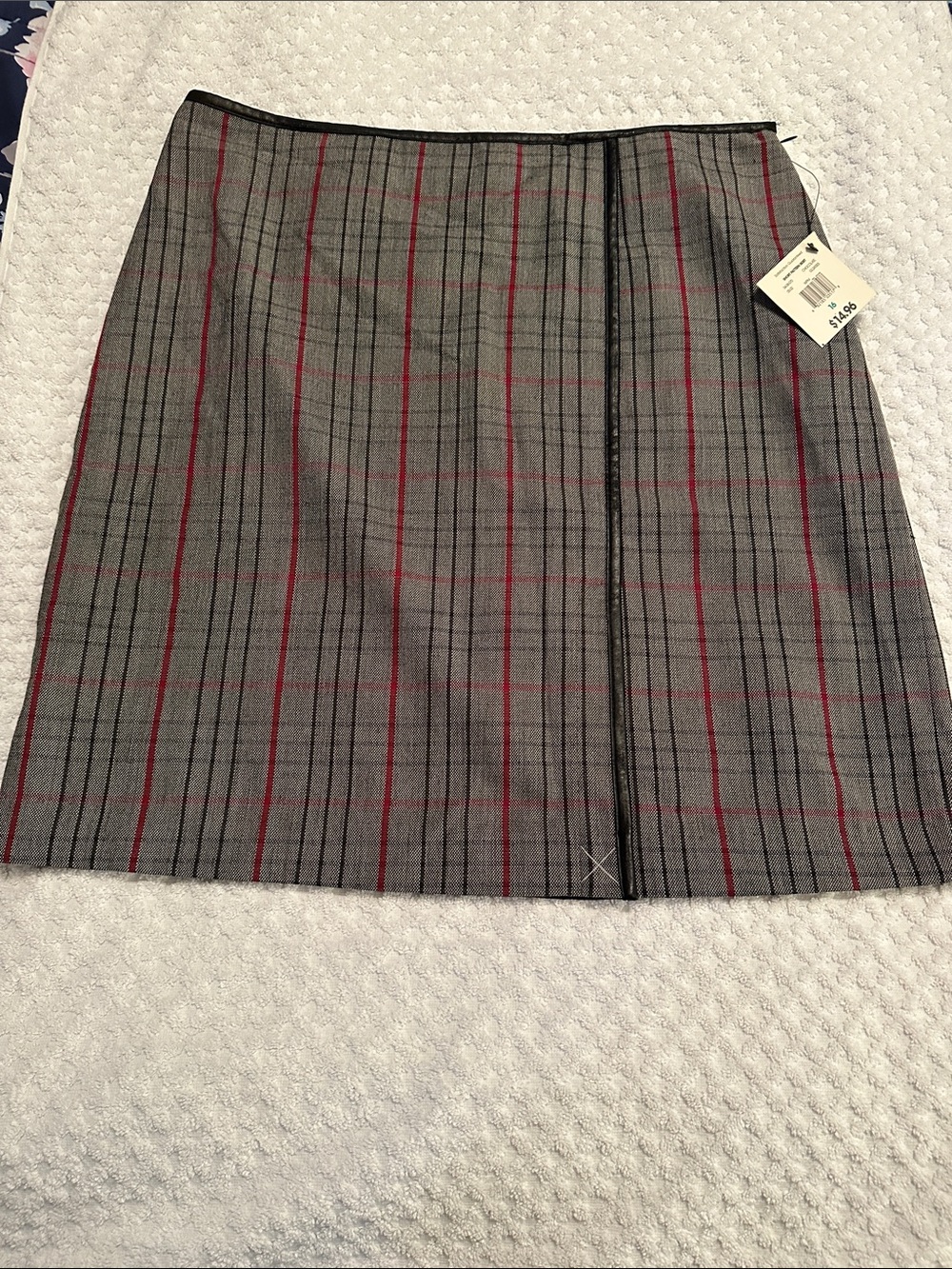 Vintage George plaid lined skirt with faux leather trim.